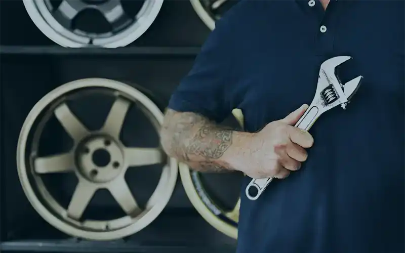 mechanic-holding-wrench